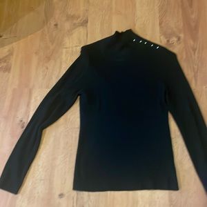 Black turtleneck sweater with gold button detail